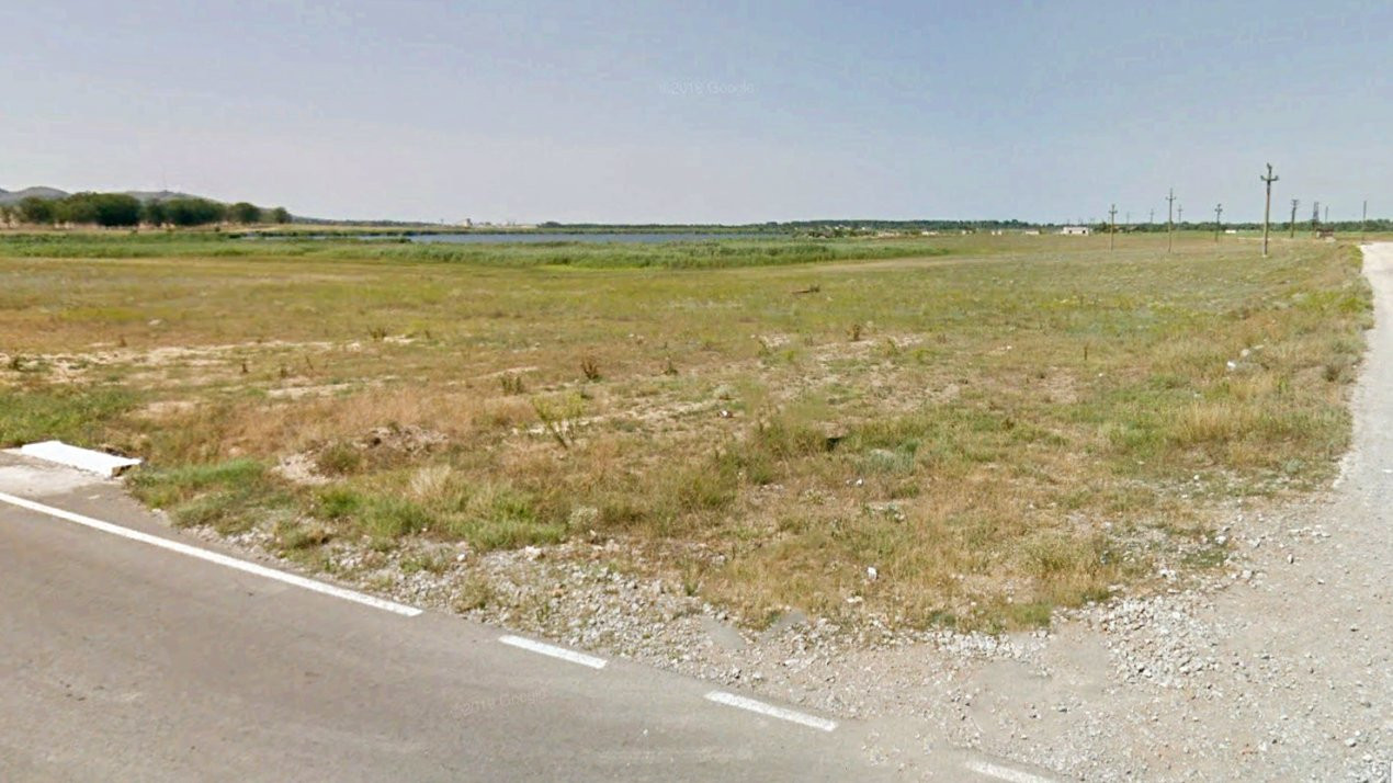 Teren intravilan de 1 Ha, cu iesire la lac, pretabil parc fotovoltaic sau turism